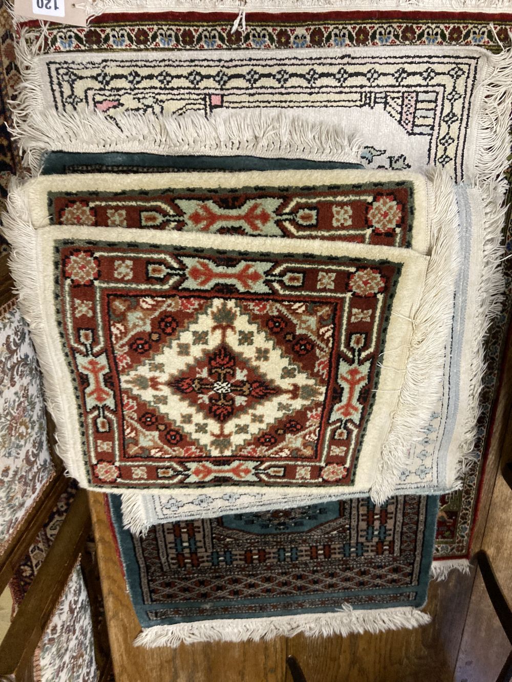 A Persian silk prayer rug and six other Eastern mats, largest 80 x 60cm (7)